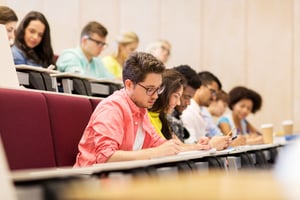 Students taking notes during a seminar